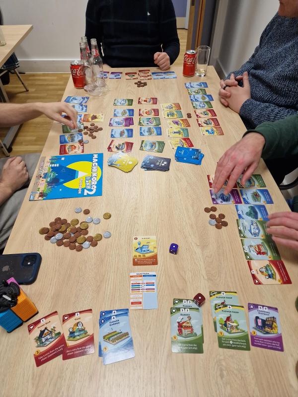 Machi Koro 2 on the table, photo by Charlie King