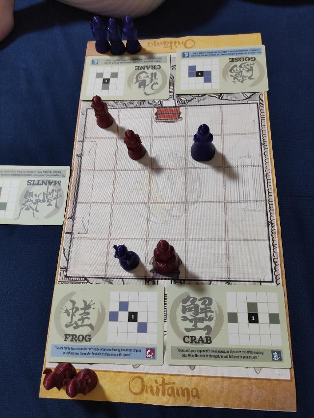 Onitama sobre la taula, foto de Sebashi