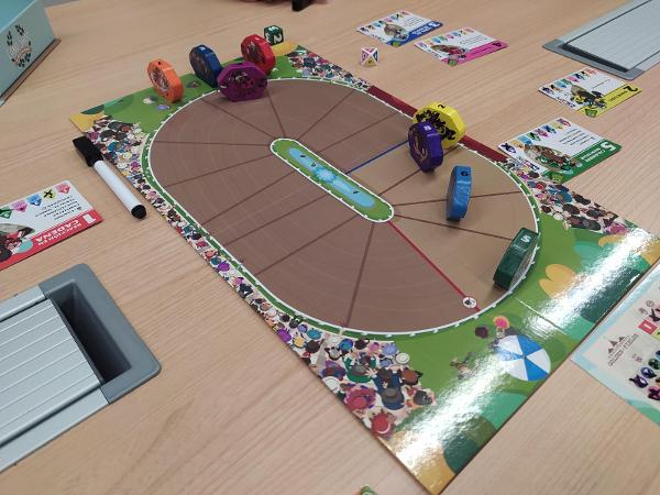 Long Shot: The Dice Game on the table, photo by David Puyalto