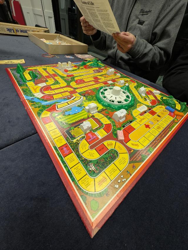 The Game of Life (2013- Editions) on the table, photo by Brandon Storm