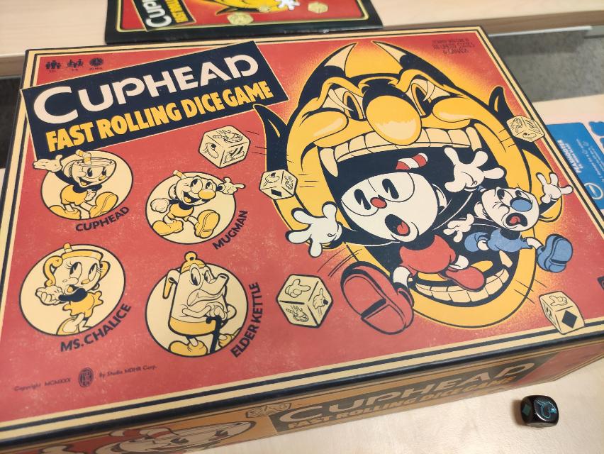 Cuphead: Fast Rolling Dice Game on the table, photo by Sebashi
