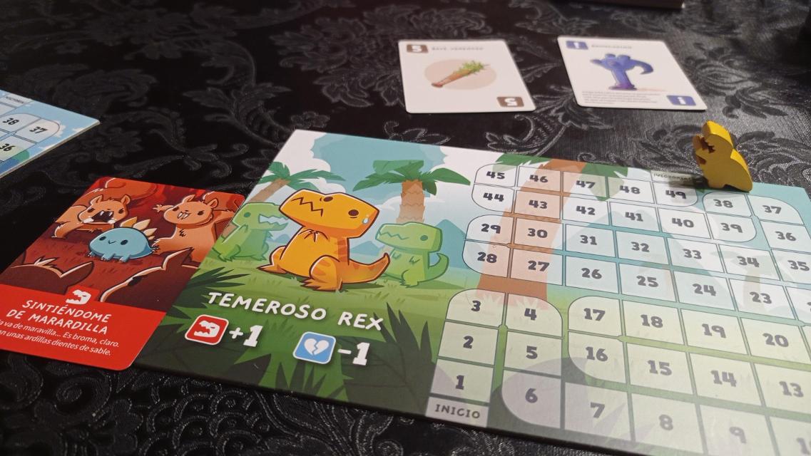 Happy Little Dinosaurs on the table, photo by Carcolo